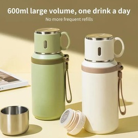 A 20.29 ounce stainless steel thermos with a lid, suitable for outdoor activities to keep drinks hot and cold - Colour: green