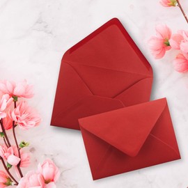 C7 envelopes, pointed flap, wet glue.