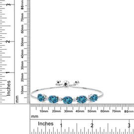Gem Stone King - Pulsera de tenis de plata de ley 925 con topacio azul londinense y topacio blanco para mujer (7.84 quilates, piedra natal, ovalada 8 x 6 mm, totalmente ajustable hasta 9 pulgadas), 22.9 cm, Plata de ley, Topacio